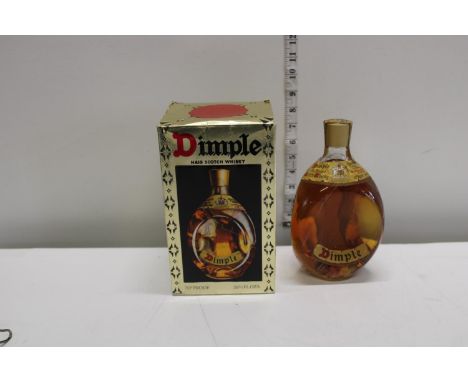A bottle of vintage Dimple Scotch whisky 