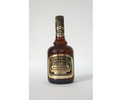BOWMORE 12YO
An old-style bottling of the Bowmore 12 year old single malt scotch whisky in the dumpy brown bottle.  75cl.  40