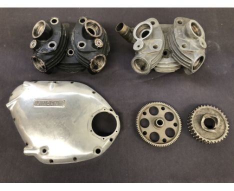 Two Vincent cylinder headswith casting numbers ET22F and BA70798, used condition, one in black; together with a Vincent timin