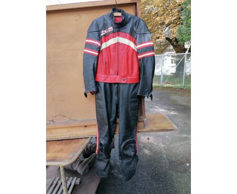 A set of Dainese one-piece race leathers, signed by Giacomo AgostiniSize unknown. The vendor advises these leathers were proc