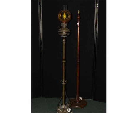 Brass oil standard lamp now converted to electricity, the lower section with scroll decoration on a domed gadrooned base with