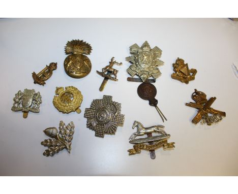 Collection of British army cap badges, Royal engineers, Highland Light Infantry, Royal Scots Fusiliers, etc, mainly repro, (1