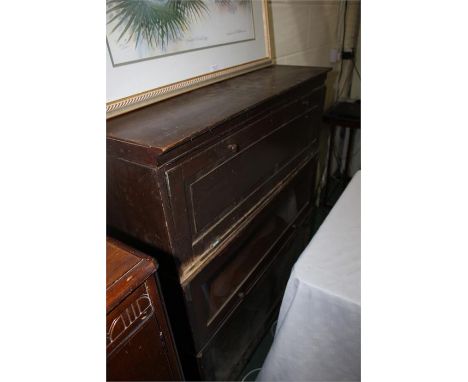 Globe Wernicke style sectional bookcase, consisting of two glazed and one panelled section, with up and under doors, on a non