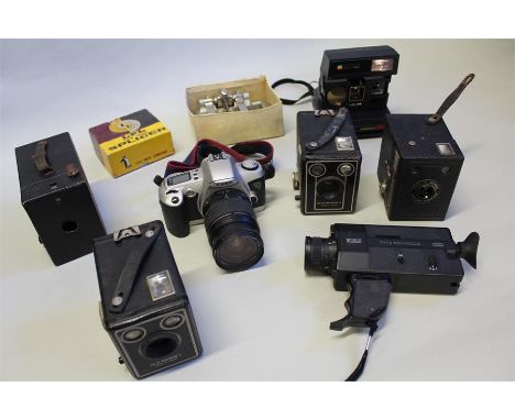 Collection of vintage cameras and accessories including Kodak Brownie C, Kodak Brownie D, Kodac Brownie 127, Canon EOS 500, e