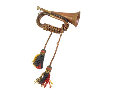 BOOSEY &amp; HAWKES LTD OF LONDON: A MILITARY BRASS AND COPPER BUGLE stamped with a military crows foot, dated 1938, 28cm lon
