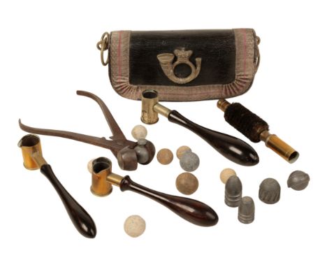 A 19TH CENTURY MILITARY AMMUNITION POUCH, three powder measures; a bullet mould; and various lead musket bowls (a lot)Provena