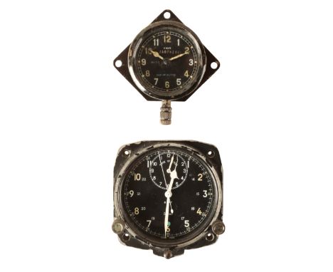 SMITHS: A MILITARY 8 DAY COCKPIT CLOCK with manual wind movement, the dial with subsidiary seconds dial, white luminous Arabi
