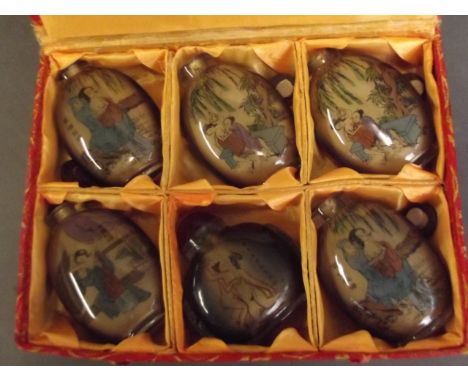 A set of six erotic snuff bottles, in a fitted box, 3½'' long