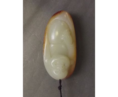 A Chinese mottled jade pendant carved in the form of laughing Buddha, 2½'' long