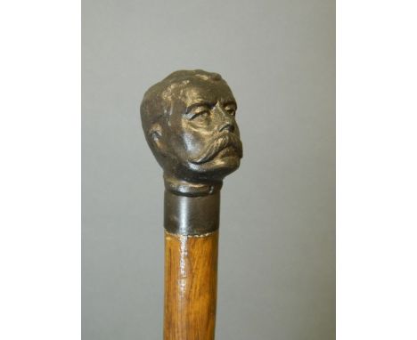A spelter handled walking stick in the form of Lord Kitchener's head, 32½'' long