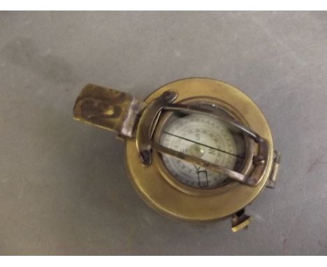 A brass military compass by T.G. Co. Ltd, London, Mark III-1943, 3½'' long