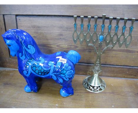A Blue Pottery Horse, with floral decoration, and a brass Star of David candlestick. (2)