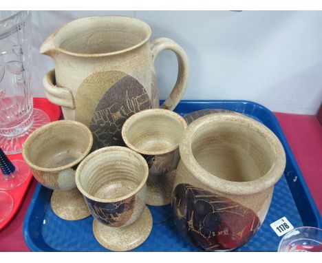 Crich Pottery -  A large stoneware pitcher, with stylised flowers with goblets, with similar decorated and other pieces, with