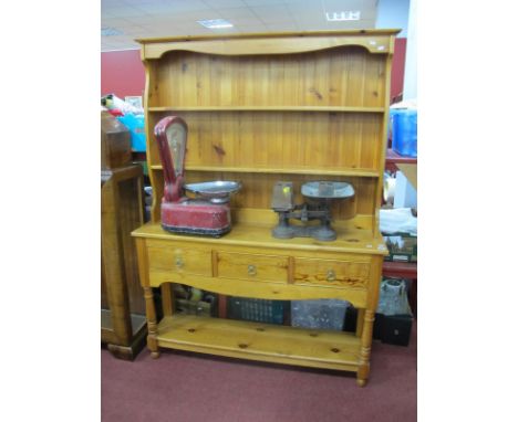 A Pine Dresser, the rack with two shelves, base with three drawers, on turned and block supports, with under shelf.