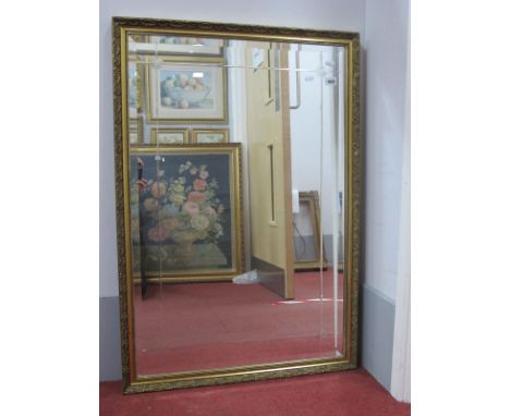 A Gilt Rectangular Shaped Wall Mirror, with bevelled glass, and etched decoration, 99 x 68.