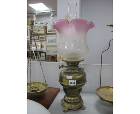 A Brass Oil Lamp, with glass funnel and shade with wavy rim.
