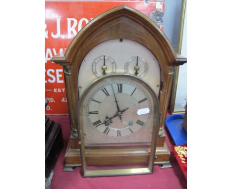 An Early XX Century Mahogany Eight Day Mantle Clock, with a silvered dial, reeded columns on gilded brass bracket feet. 