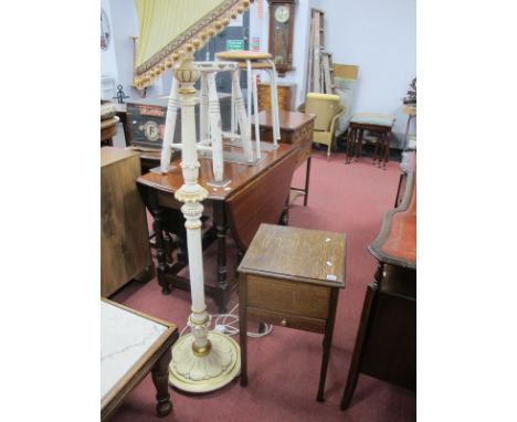 A White Painted Standard Lamp, with gilt highlights, together with an oak sewing table. (2)