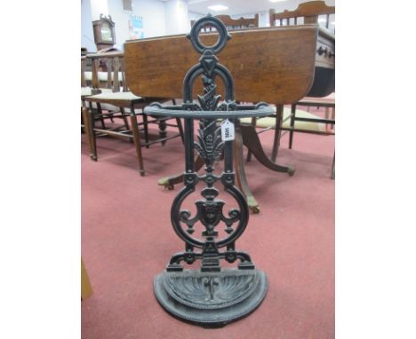 A Black Painted Cast Iron Umbrella/Stick Stand, with drip tray (stamped No 31).