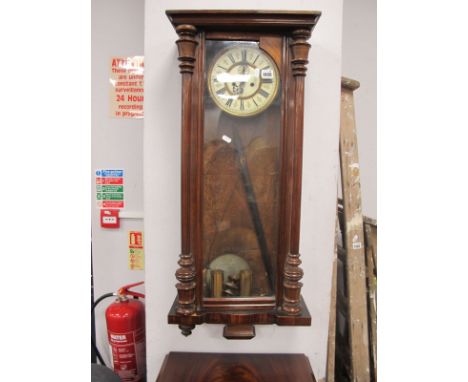 A XIX Century Walnut Cased Two Weight Vienna Wall Clock, circular dial, with Roman numerals, turned supports.