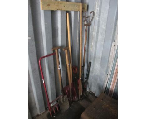 A Snow Shovel, Rake, fork, other tools.