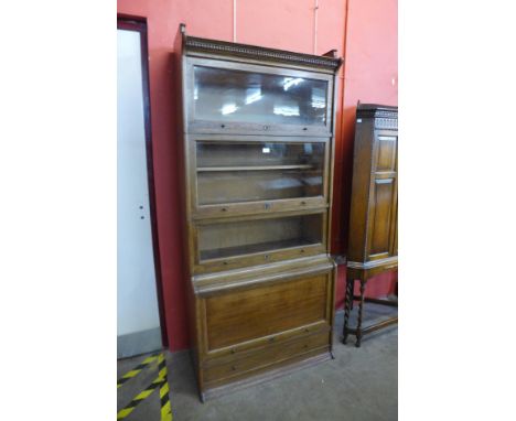 An early 20th Century Lebus oak five tier sectional stacking bookcase, 198cms h, 88cms w, 44cms d 