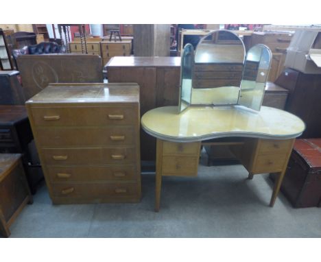A light oak chest of drawers and a dressing table 