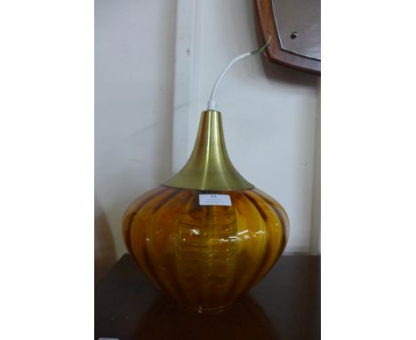 An amber glass onion shaped ceiling light 