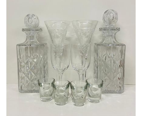 A Selection of glassware to include two decanters, two Dartington dessert wine glasses, two Waterford crystal champagne glass