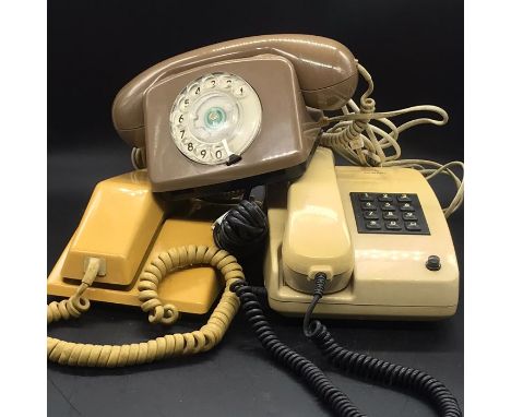 A Vintage Siemens push button phone and two other vintage phones.