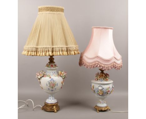 Two large Capodimonte table lamps with floral decoration and brass base, largest lamp approximately 190cm tall.