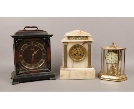 A 19th century alabaster mantle clock housing a French 8 day movement, a Meiji 30 day mantel clock and a Kundo torsion clock.