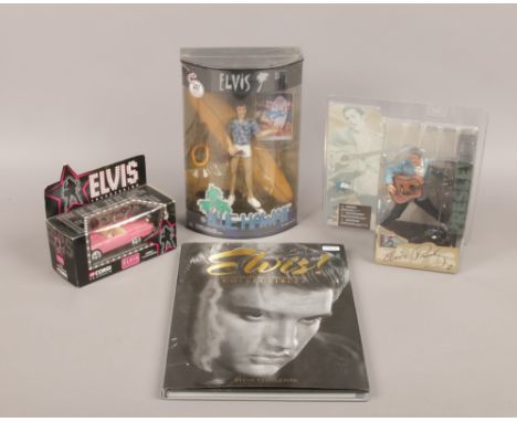 Two boxed Elvis Presley figures along with a Elvis illustrated guide to new and vintage collectables and a Corgi pink Thunder