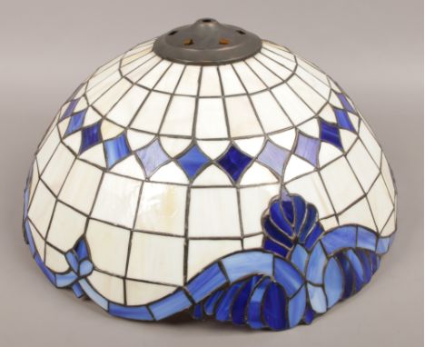 A large Tiffany style leaded glass lamp shade.