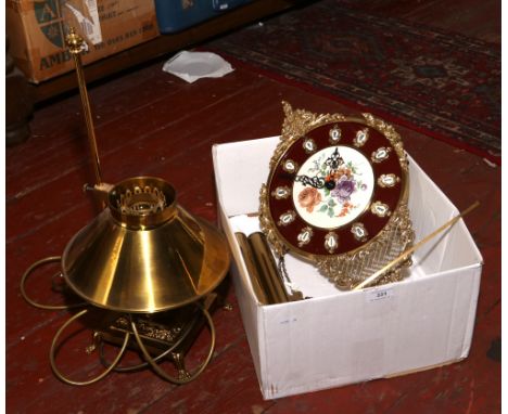 A West German brass wall clock along with a brass vintage style table lamp.