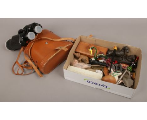 A box of collectables to include cased binoculars, dominoes, wood carved animals etc.