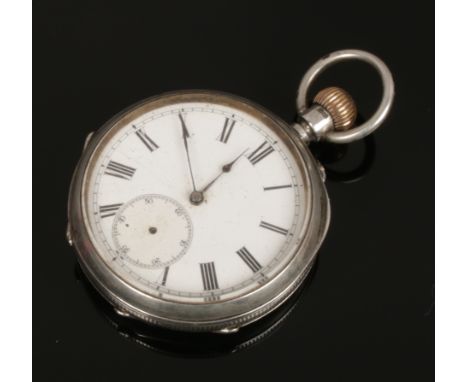 A silver pocket watch with Roman numeral markers, assayed Birmingham 1885.