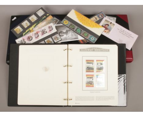 Two albums of Medallic first day covers; The History of World War II and The Millennium, along with an album of railway herit