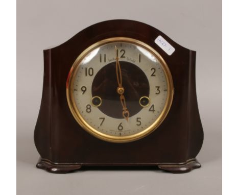 A Bakelite cased Smiths Enfield 8 day mantel clock chiming on a coiled gong complete with key and pendulum.Condition report i