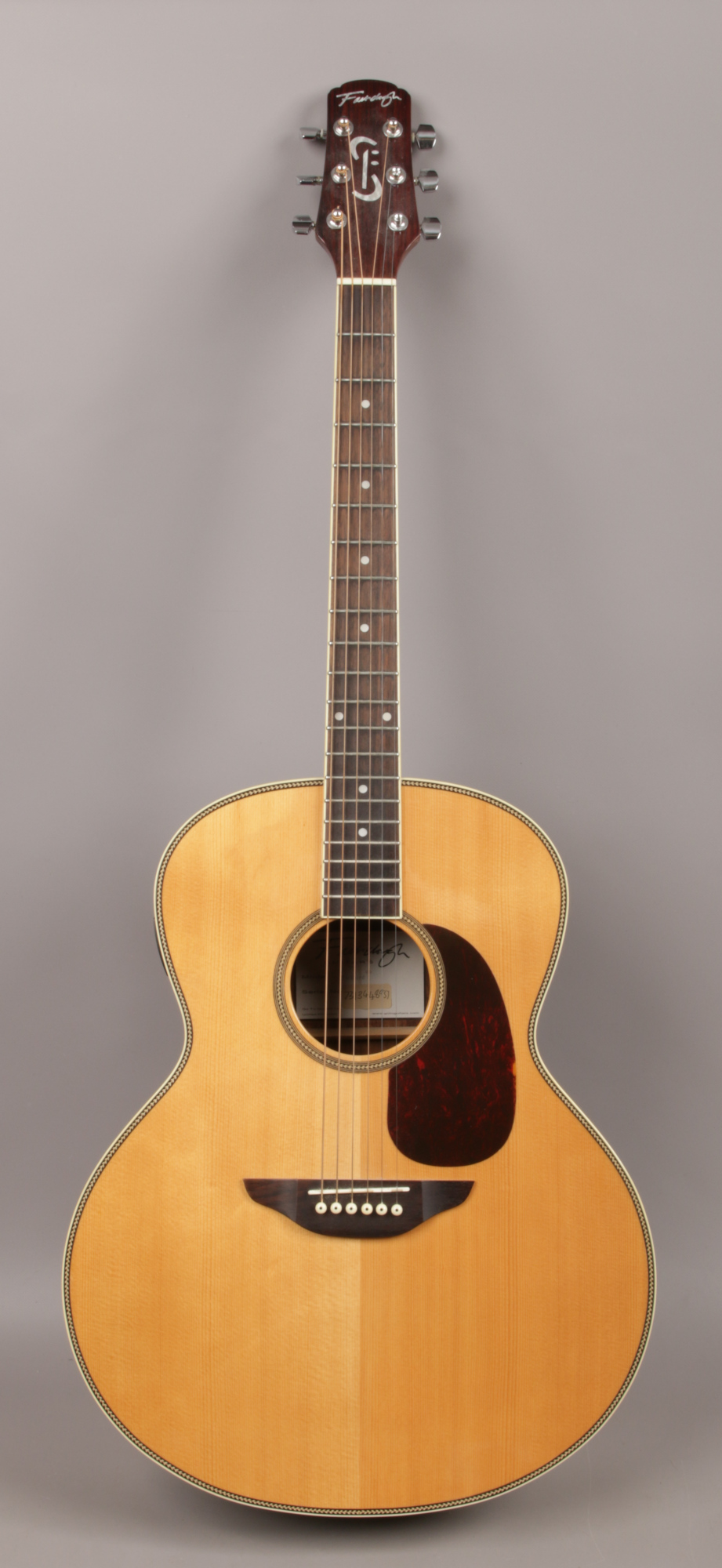 A Fairclough 'Blackbird' acoustic guitar with built in tuner in Stagg