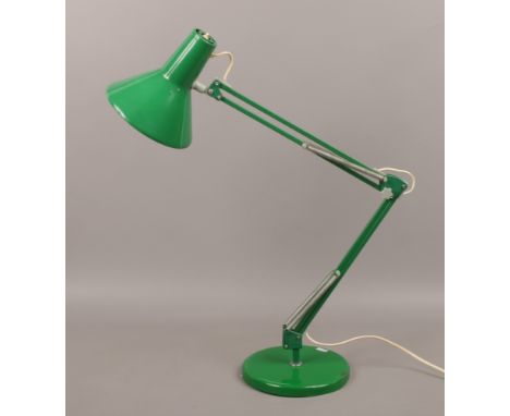 A green anglepoise lamp.