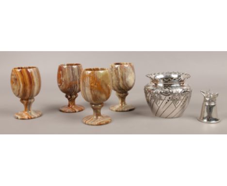 Four onyx goblets along with a silver plated fox stirrup cup and a silver plated planter.