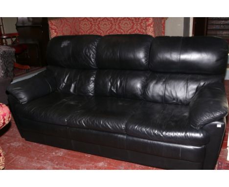 A black leather three seat sofa.