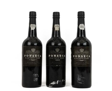 Fonseca vintage port - 2 x 1992 and 1 x 1994, each 75cl 20.5% alc/vol. The 1992 - fill high, one label torn to edge, capsules