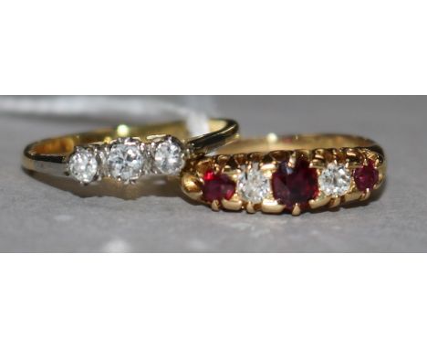 A three-stone diamond ring, 18ct gold shank and an 18ct gold, ruby and diamond half-hoop ring