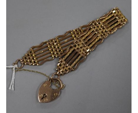 A 9ct gold gate-link bracelet with padlock clasp.