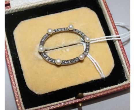 An early 20th century gold and silver, rose cut diamond and cultured pearl set open circular brooch, width 33mm.
