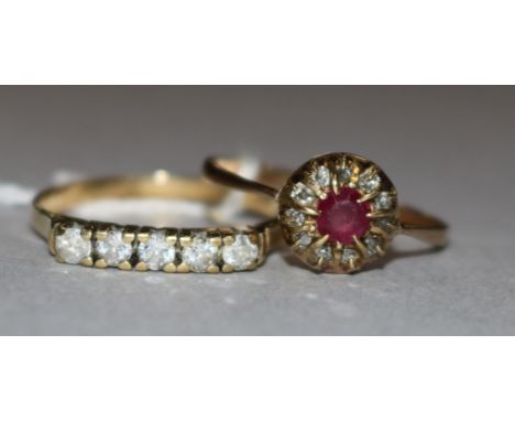 A ruby and diamond cluster ring and one other ring.