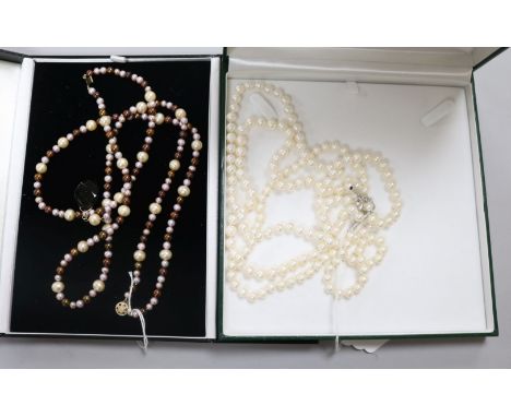 A triple strand cultured pearl necklace with silver clasp. A double row South Sea cultured pearl necklace, 51cm