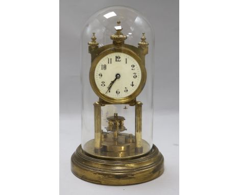 A gilt-brass torsion clock under glass dome
